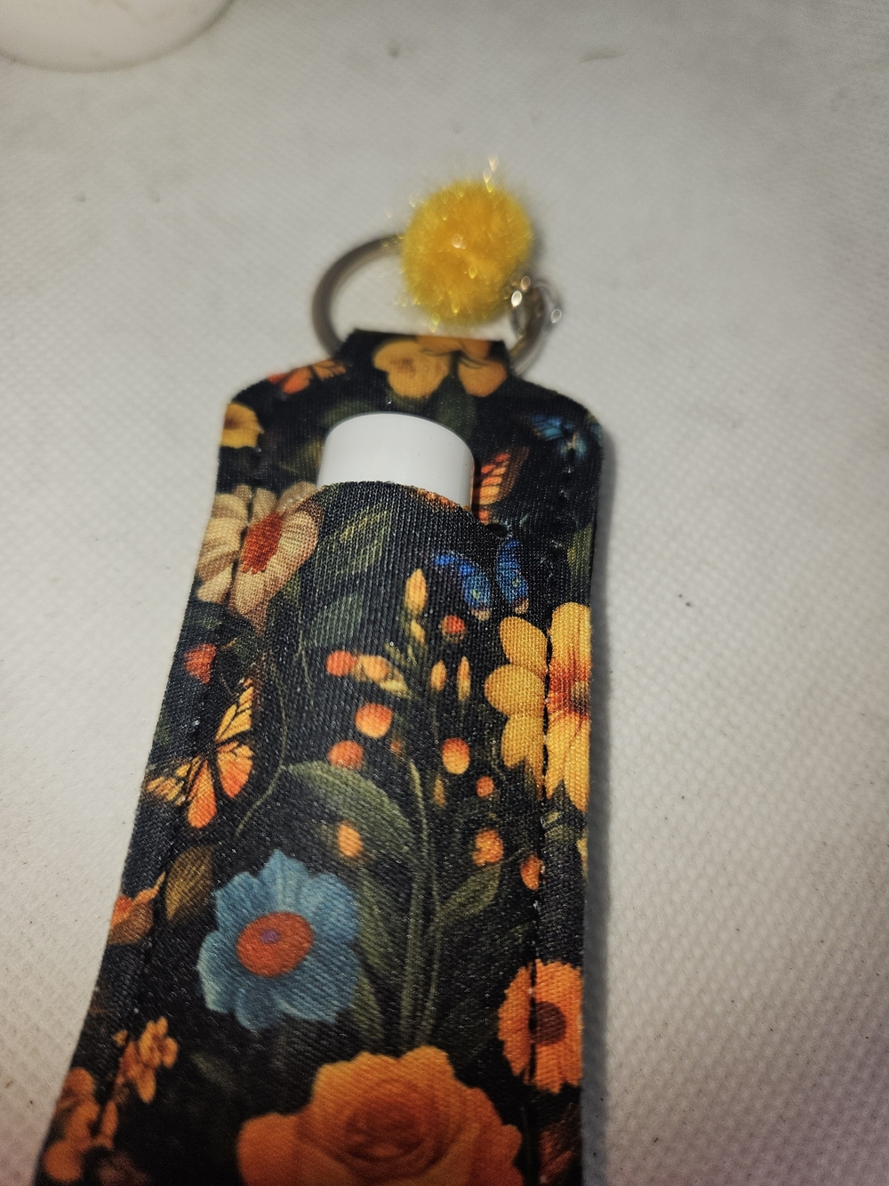 Floral Black Lip Balm Keychain Holder with Yellow Pom Pom